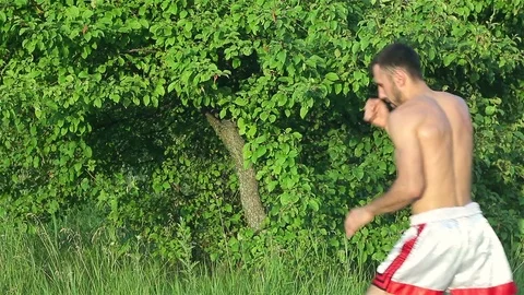 Man Kickboxer exercising kicks Stock Footage 77266863