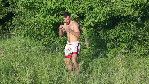 Man Kickboxer exercising kicks Stock Footage 77268999