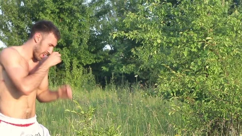 Man Kickboxer exercising kicks Stock-Footage 77269418