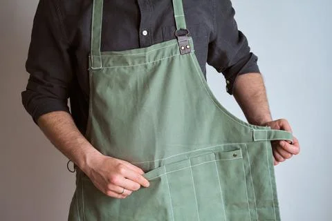 A man in a kitchen apron. Chef work in the cuisine Stock Photos