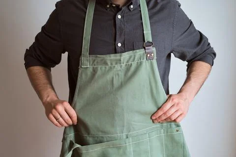 A man in a kitchen apron. Chef work in the cuisine Stock Photos