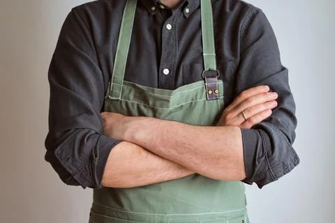 A man in a kitchen apron. Chef work in the cuisine Stock Photos