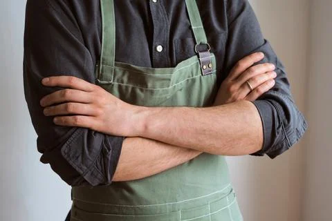 A man in a kitchen apron. Chef work in the cuisine Stock Photos