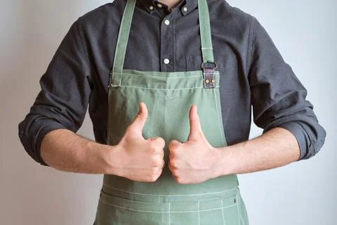 A man in a kitchen apron. Chef work in the cuisine Stock Photos