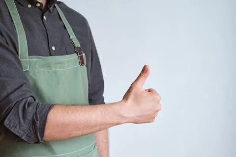 A man in a kitchen apron. Chef work in the cuisine Stock Photos