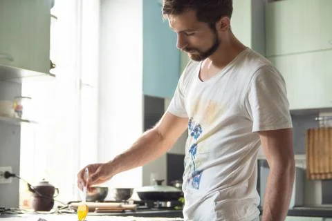 Man in the kitchen with a culinary brush Stock Photos