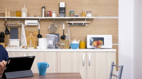 Man in the kitchen drinking coffee Stock Footage 97277204