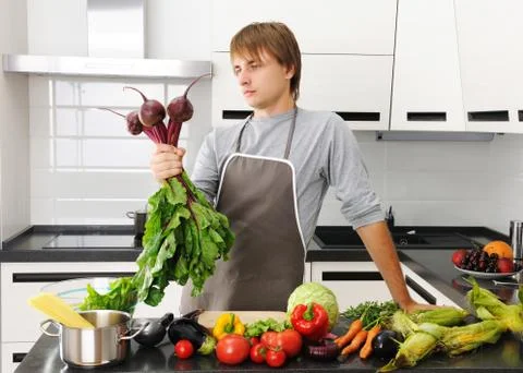 Man in kitchen Stock Photos