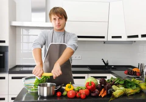 Man in kitchen Stock Photos