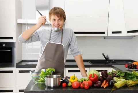 Man in kitchen Stock Photos