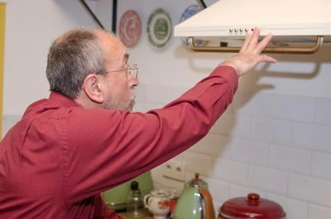 Man on the kitchen Stock Photos