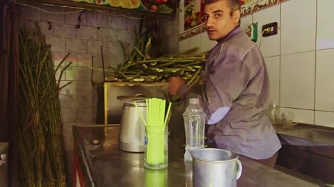 A man in a kitchen preparing food Stock Footage 292212692