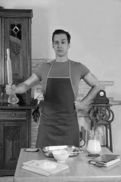 Man in the kitchen with rolling pin Stock Photos