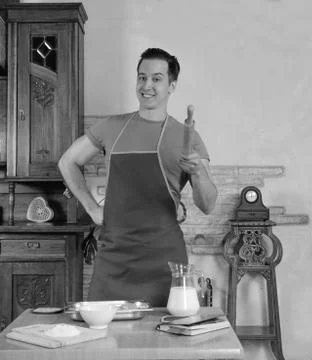 Man in the kitchen with rolling pin Stock Photos