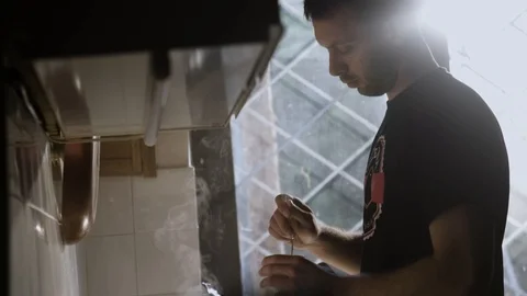 Man In The Kitchen Steering Fresh Made Cup Of Coffee 1 Stock Footage 88808782