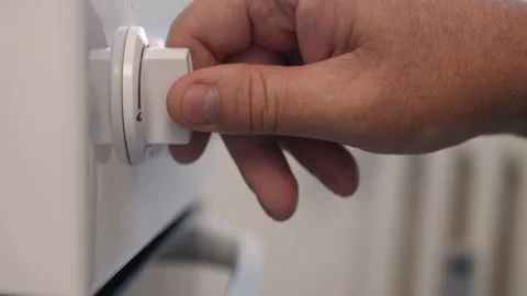 A Man in the Kitchen Stops the Gas Cooker Rotating the Front Button Closing the Stock Footage 321247085