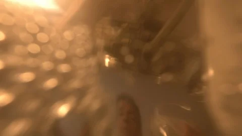A man in a Kitchen washes the dishes, close up view from the sink under water Stock Footage 103165805