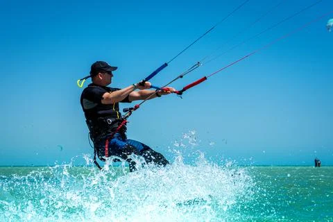 Man on kite Stock Photos