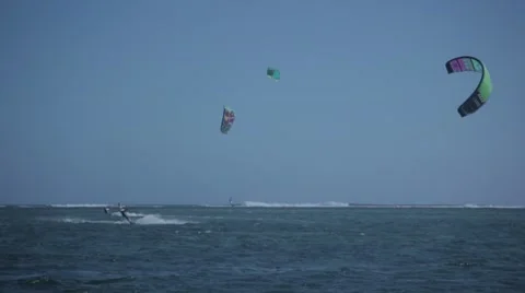 Man kite surfing and performs trick in front of camera Stock Footage 64594579