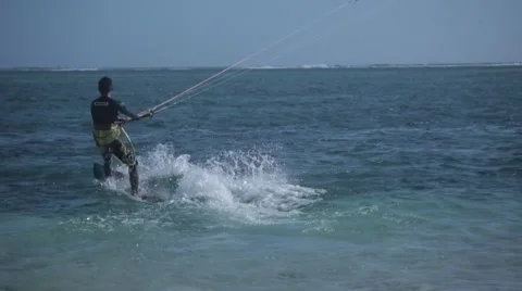 Man kite surfing away from camera Stock Footage 64594636