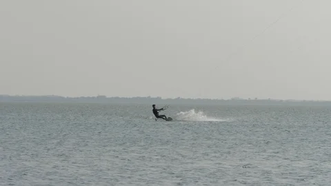 Man kiteboarder does Front Roll Handle Pass slow motion Stock Footage 118992804