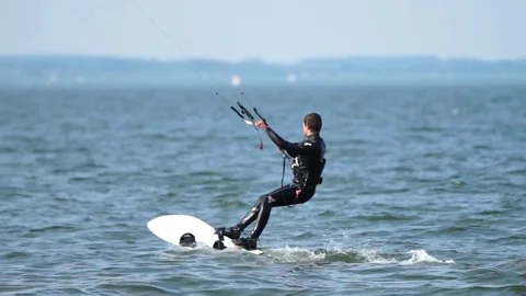 Man kitesurfing in the ocean Stock Footage 77812197