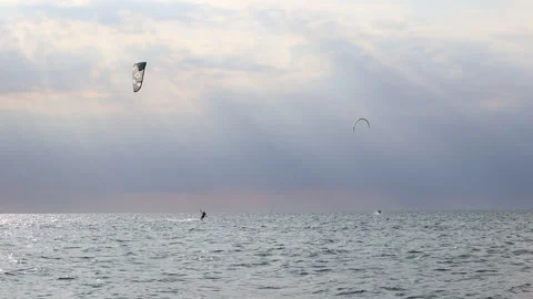 A man kitesurfs bouncing on the waves of the Baltic Sea  Stock Footage 311923316