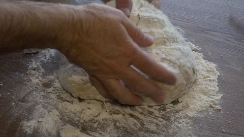 Man kneading bread Stock Footage 89447572