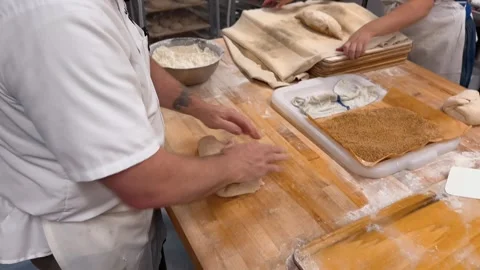 Man Kneading Dough in a Bakery Video stock 263408857