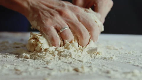Man kneading dough on table Stock Footage 274613789