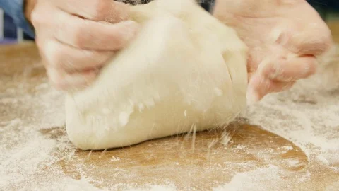 Man Kneading Dough On Table At Kitchen Stock Footage 86075154