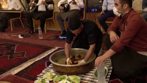 Man is kneading raw meat (cig kofte) Stock Footage 145346357
