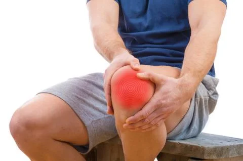 Man with knee pain over white background Stock Photos
