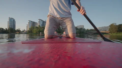 Man Kneeling on Paddle Board Rowing on River | Ultra Wide-Angle Low POV Shot 스톡 동영상 341836379