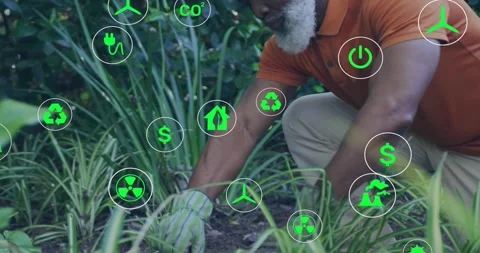 Man kneeling tending soil, gloved hand initiating floating recycle and CO2 icons Stock Footage 333873028