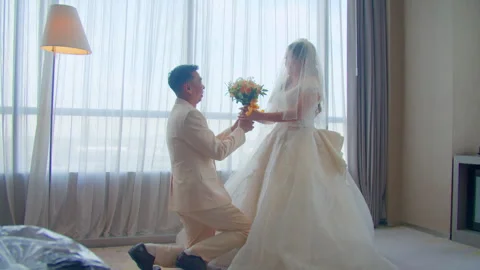 Man Kneeling While Proposing to Bride in Wedding Dress Video stock 333362031