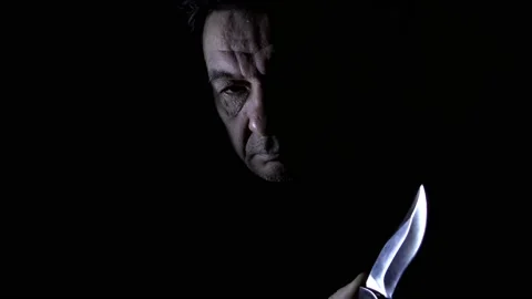 Man with a knife. Stock Footage 166605963