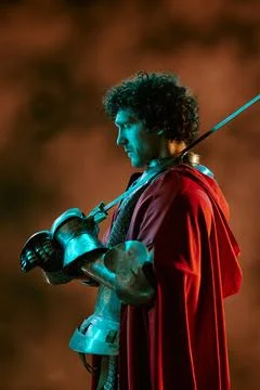 Man in Knight Armor Holding Sword for Historical Fantasy Project Stock Photos