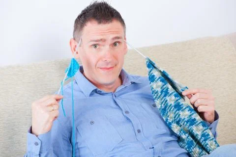 Man knitting Stock Photos