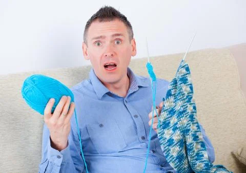 Man knitting Stock Photos