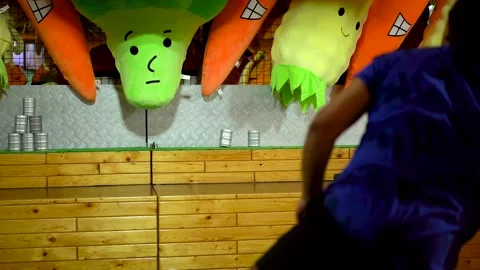 The man knocked down not all the banks in the amusement park Stock Footage 219644088