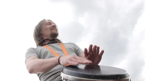 Man knocking on the drum outdoors Video stock 103920444