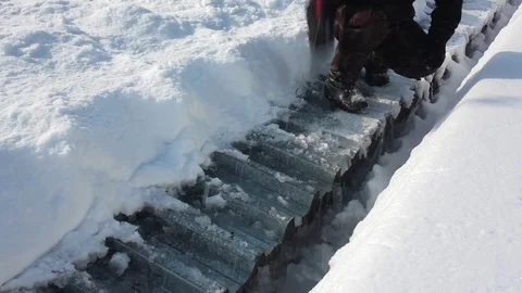 Man knocks axe ice cover on the roof Video stock 70011639