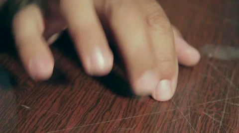 Man knocks fingers on the table. Makes rhythmic beats. Stock Footage 66309388
