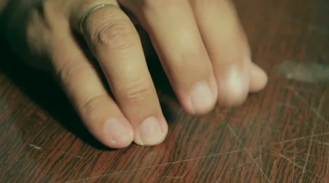 Man knocks fingers on the table. Makes rhythmic beats. Stock Footage 66309648