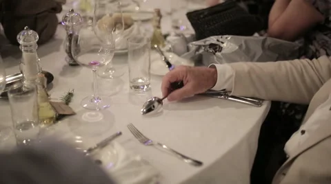 A man knocks spoon on the table Stock Footage 45963661