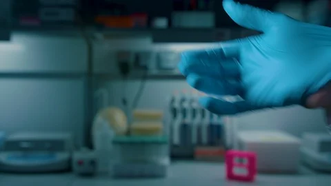 The man in the lab is wearing gloves Stock Footage 112217684
