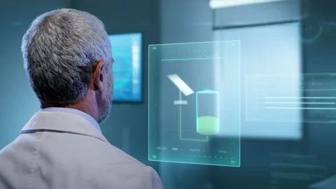 Man in laboratory working on renewable green energy sources examining data Stock Footage 158999569