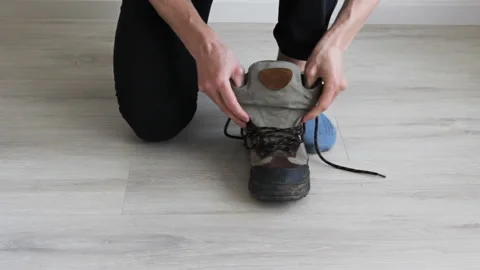 Man Lacing Up Dirty Boots . Close up of shoes. Stock Footage 130532022