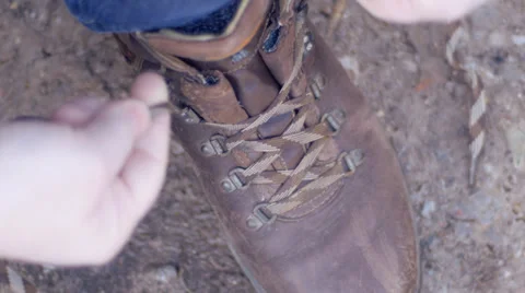 Man lacing up walking boots Stock Footage 35435525